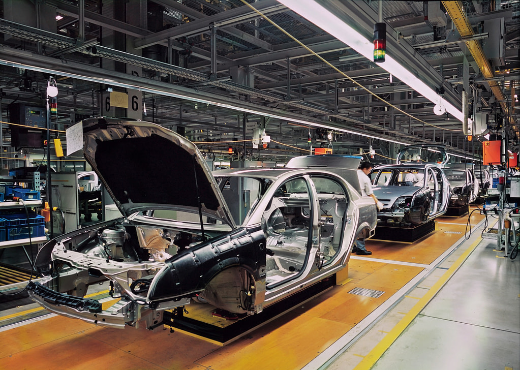 car production line with unfinished cars in a row car production line